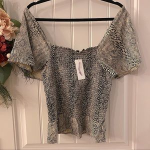 Jessica Simpson Smocked Flutter Sleeve Peplum Top in Gardenia